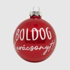 Egyetlen piros üveg karácsonyi gömb „Boldog karácsonyt!” felirattal, fehér háttér előtt.