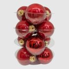 Piros üveggömb szett kibontva, fényes és gyöngyház felületű díszekkel.