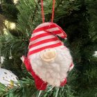 Csíkos sapkás, piros ruhás textil Mikulás figura fekete kesztyűvel és cipővel, karácsonyfára akasztva