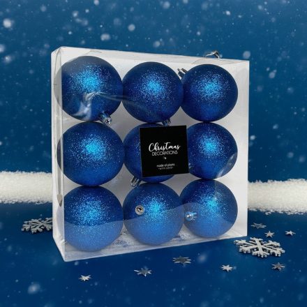 Kék glitteres karácsonyi gömb szett 9 darabos, 8 cm-es díszekkel hópelyhes háttérrel.